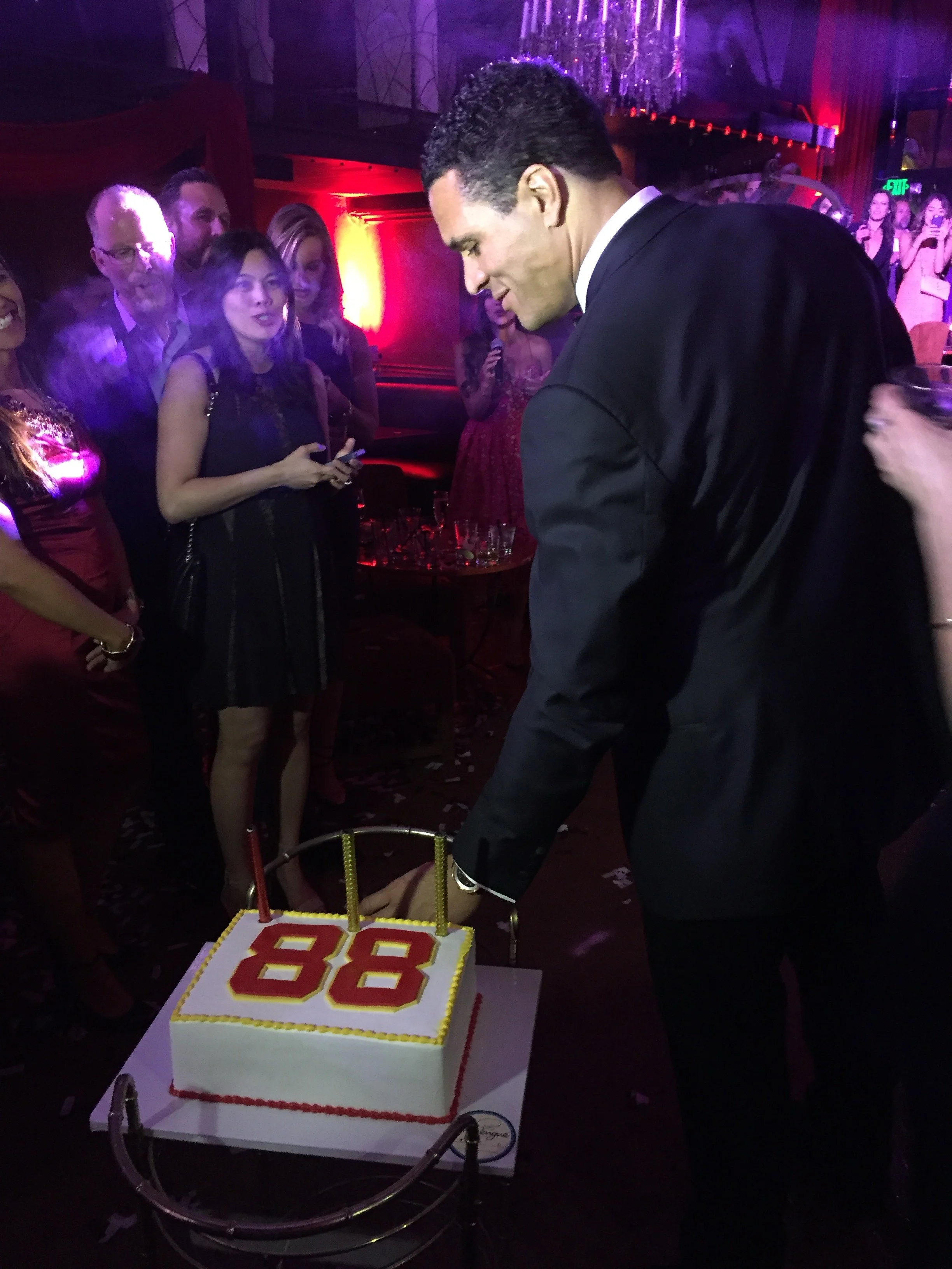 Celebratory birthday cake with the number 88 and candles