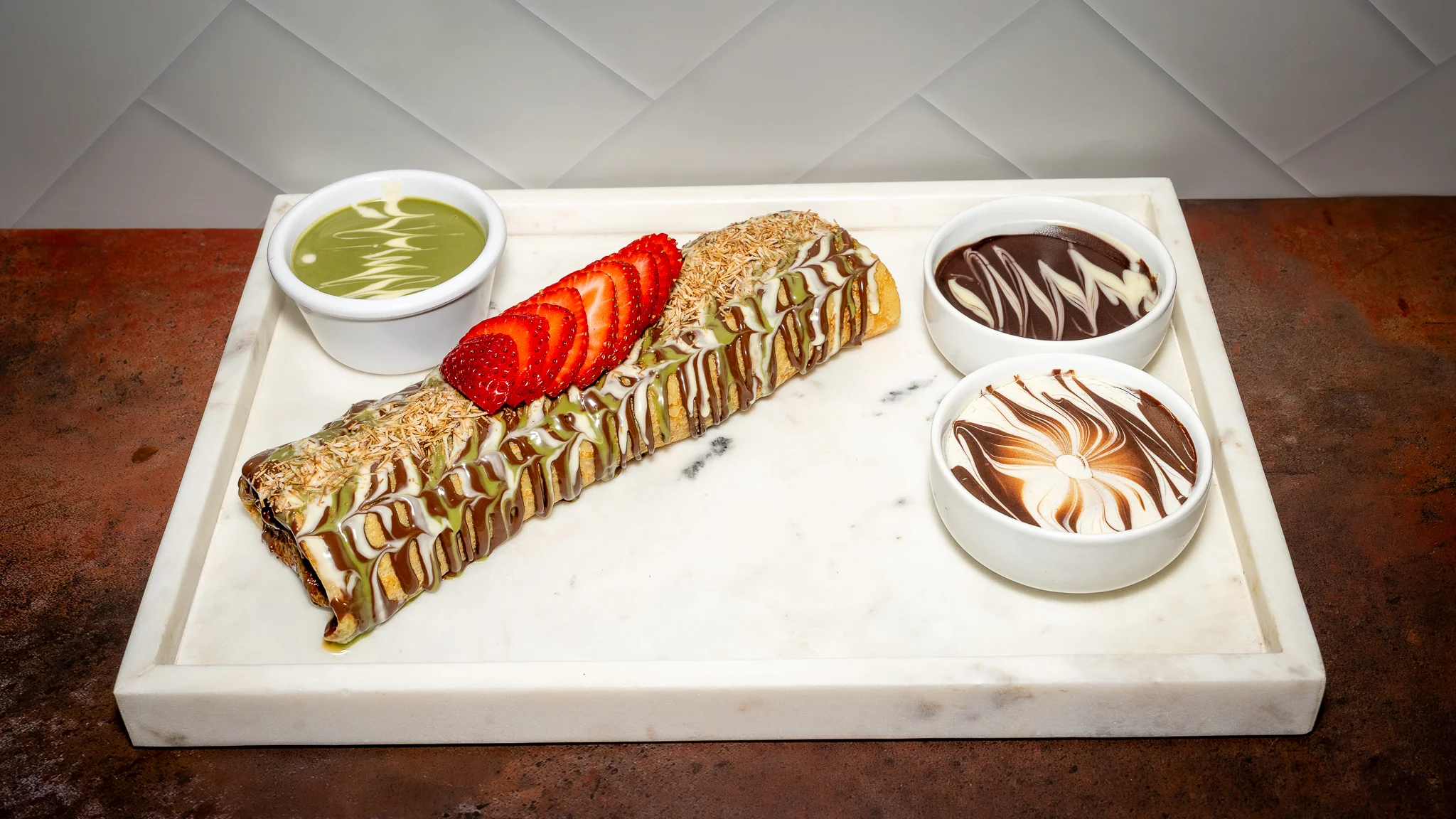 Delicious baklava dessert with chocolate and matcha sauces