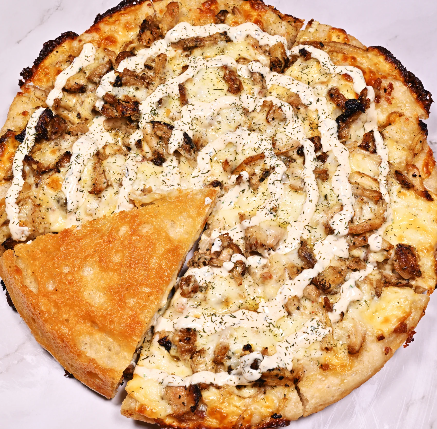 Carnitas pizza with cilantro lime sauce 