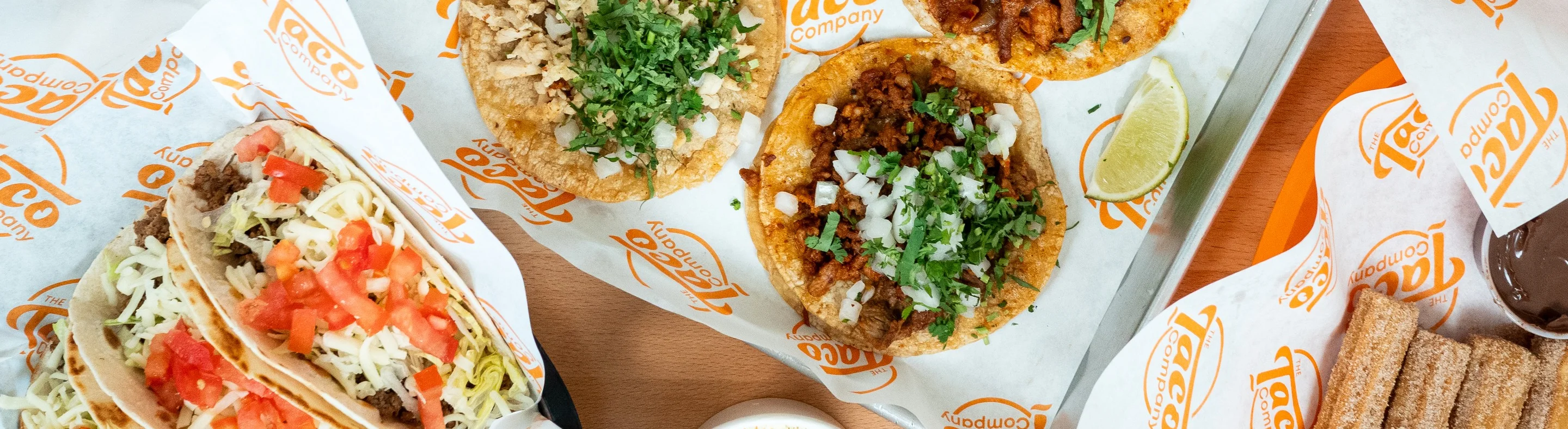 Assorted tacos and sides from a Mexican taqueria