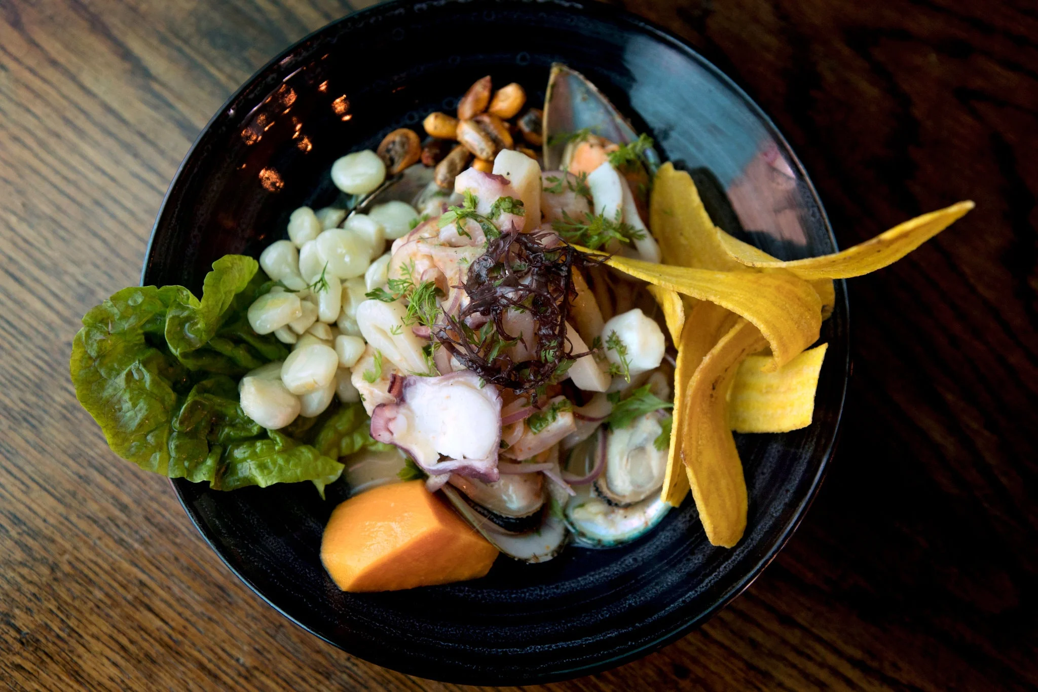Peruvian ceviche with seafood and plantain chips
