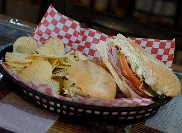 Italian sub sandwich with potato chips