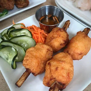 Vietnamese cha gio with pickled vegetables and dipping sauce