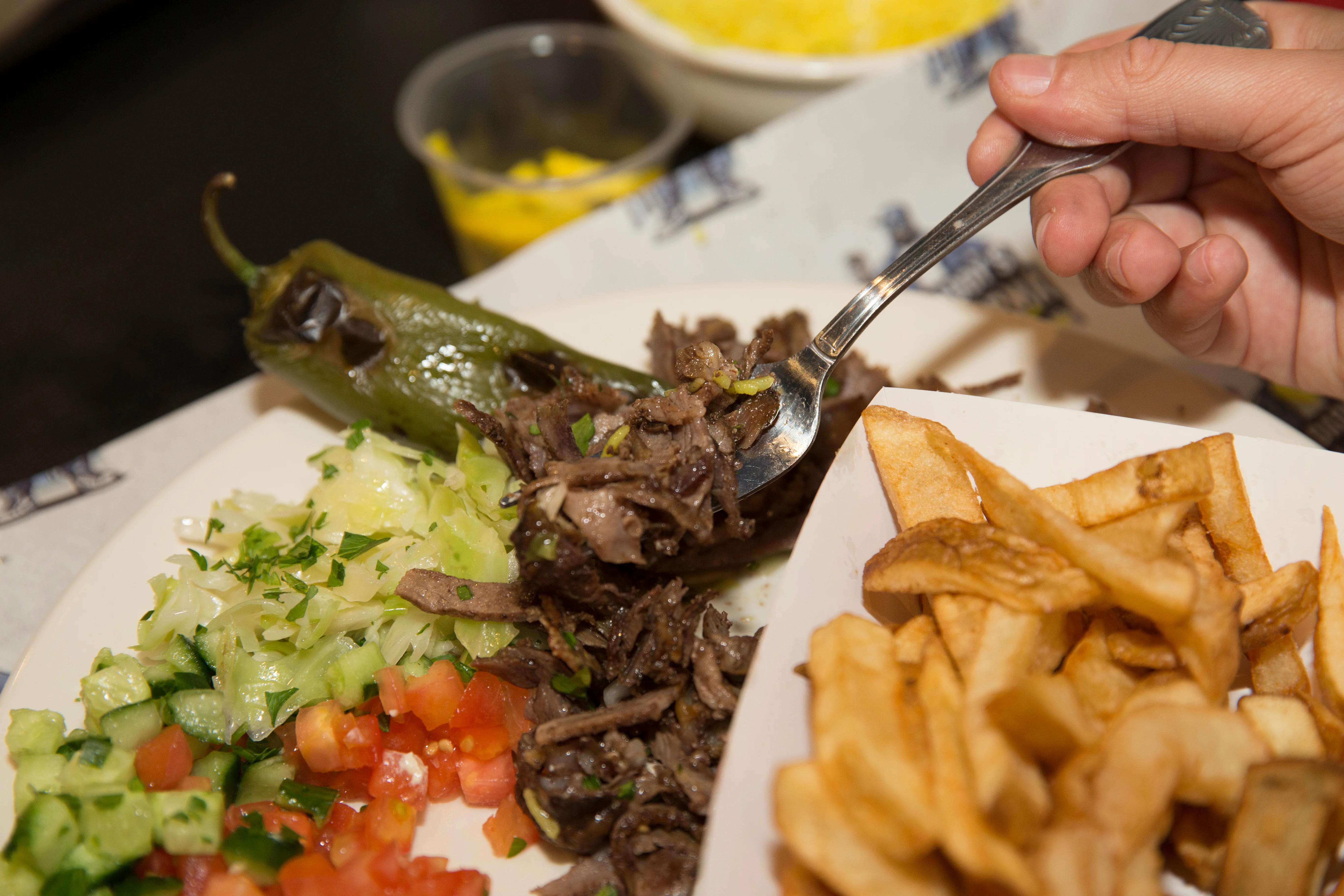 A restaurant chef preparing a dish