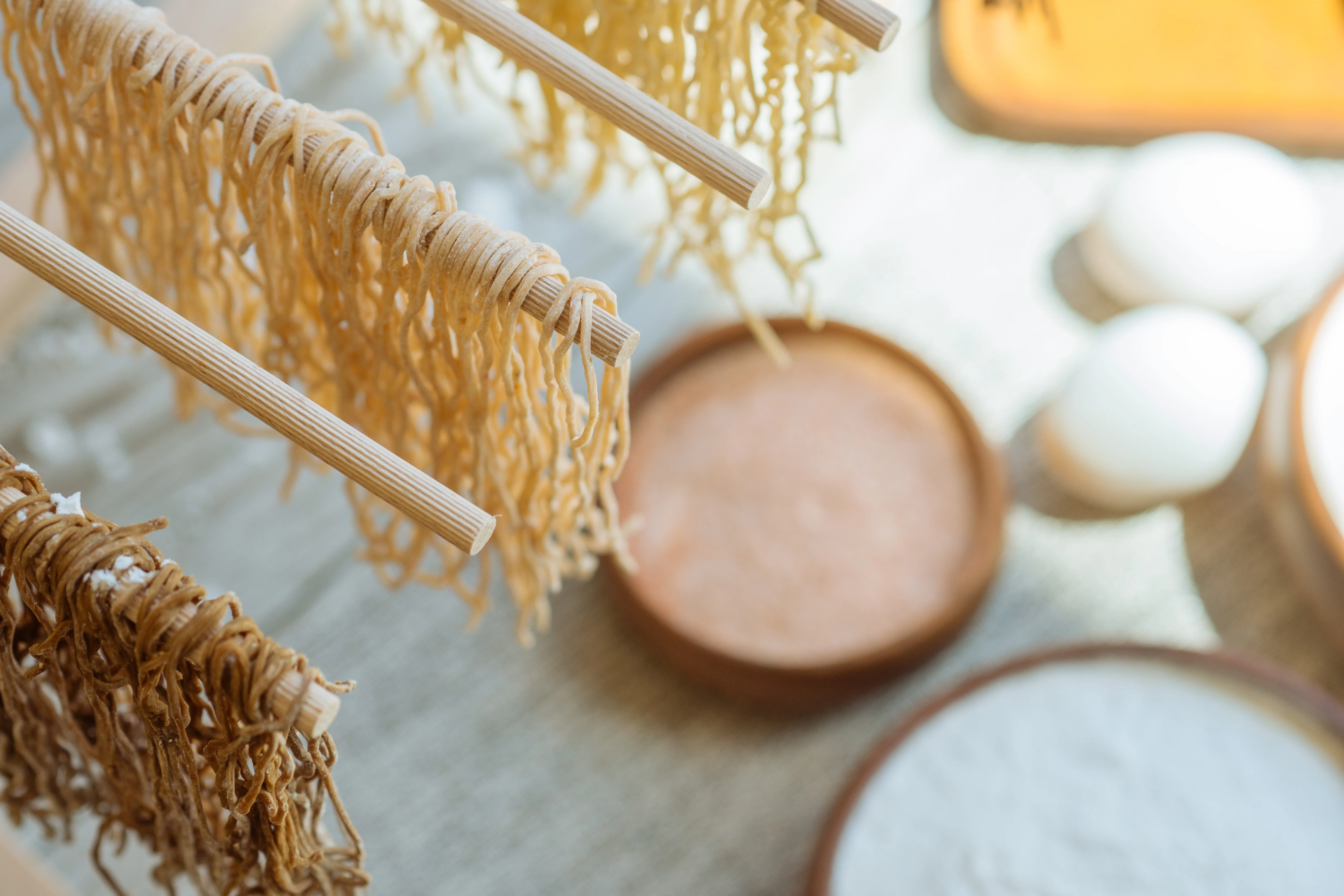 Freshly made Japanese soba noodles drying on a rack