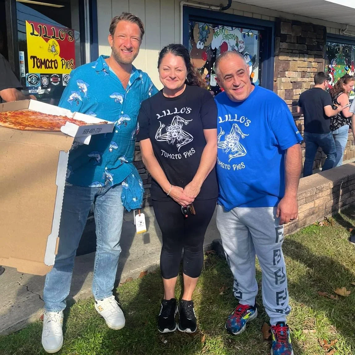 Group photo outside Lillo's Tomato Pies with pizza box