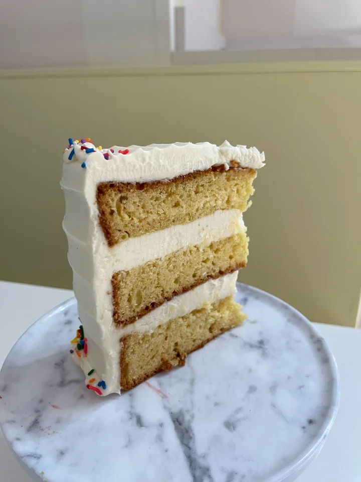 SLICE of yellow cake, vanilla buttercream