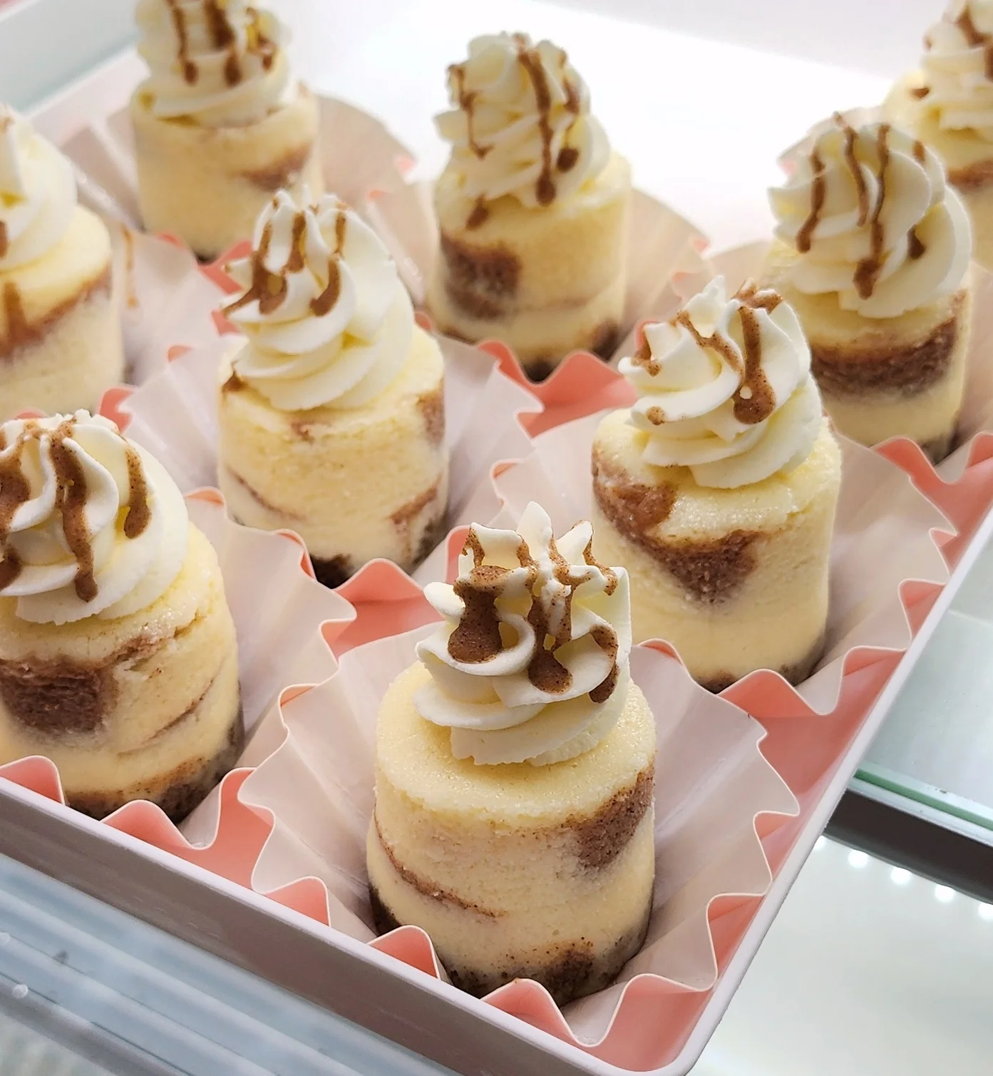 Miniature caramel cheesecake bites with whipped cream