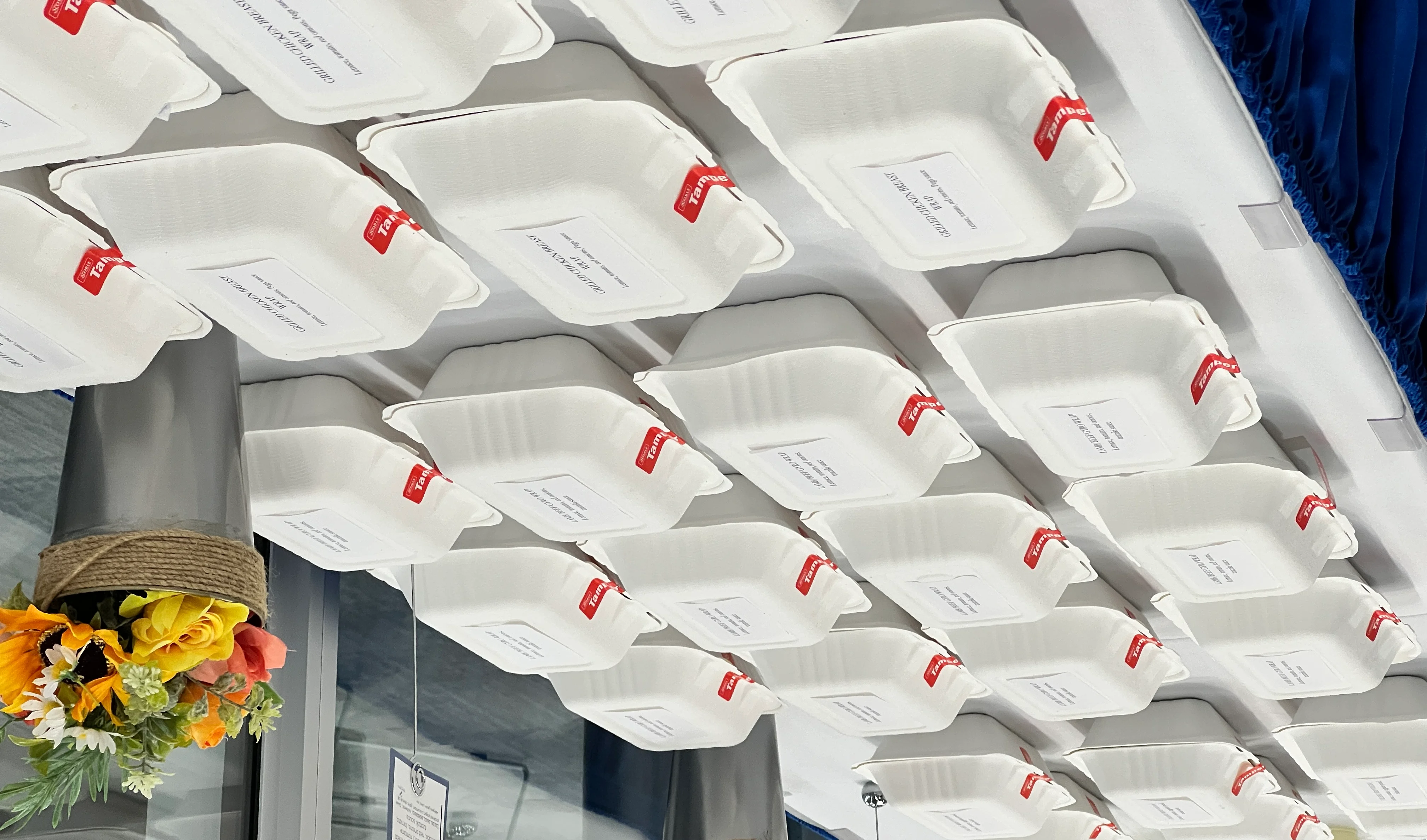 Food individually packed and labeled with sustainable containers image