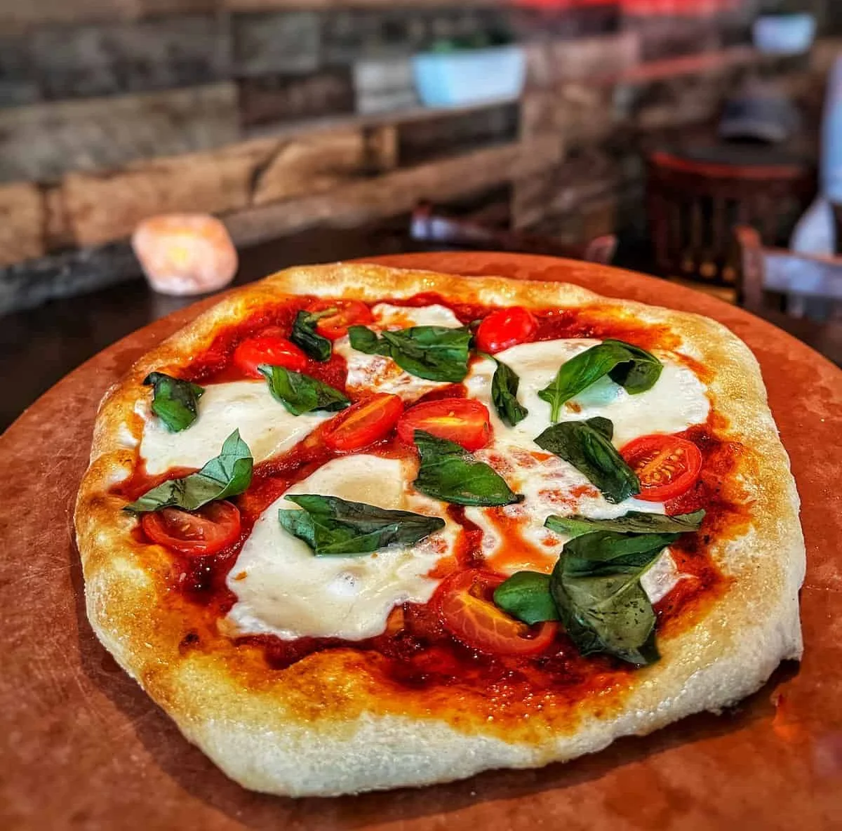 Margherita pizza with fresh basil and tomatoes
