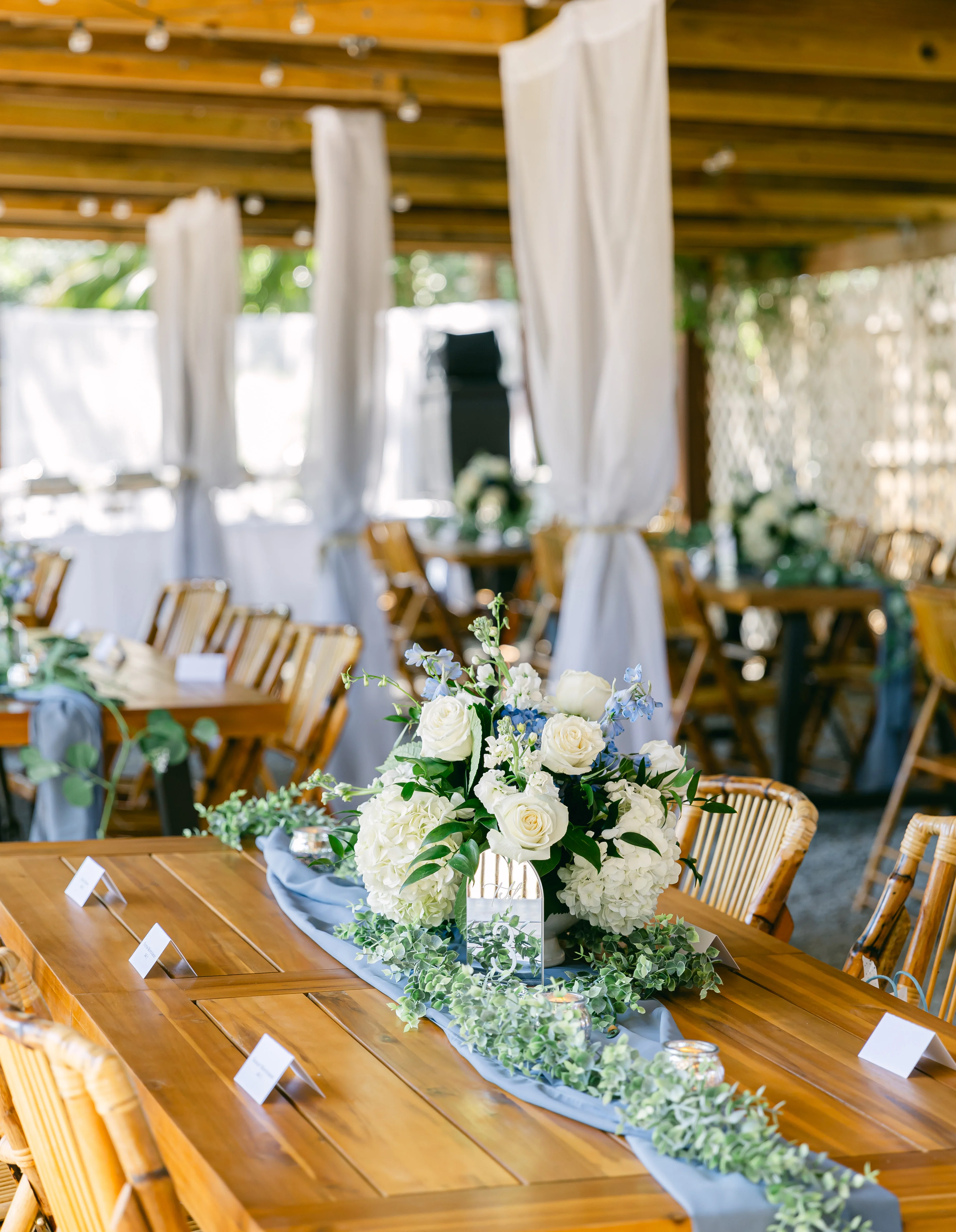 Elegant outdoor dining setup with floral centerpiece