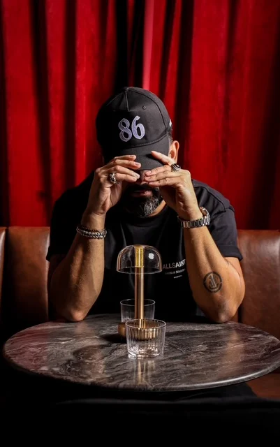 Bartender crafting a cocktail at a modern bar counter