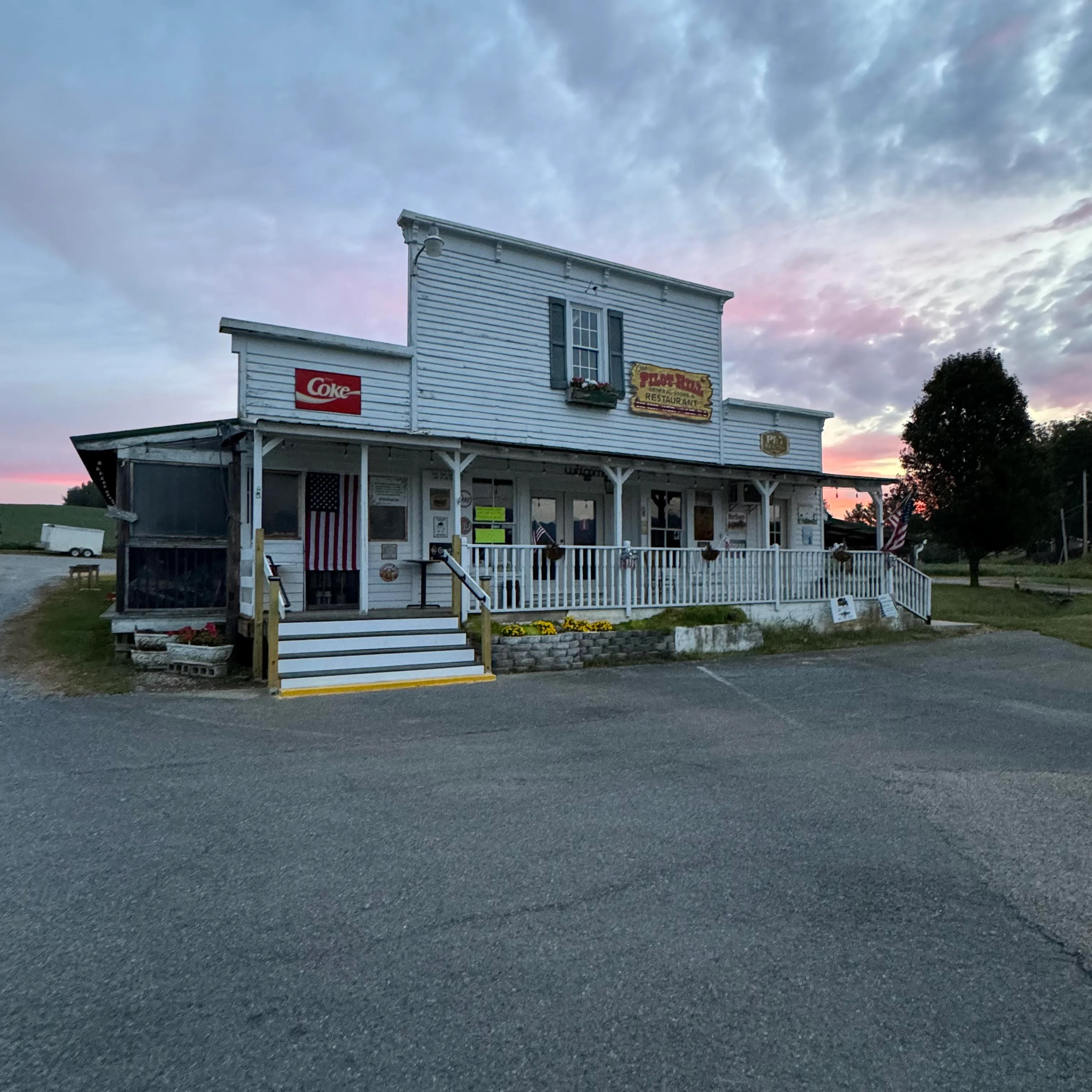 Charming country restaurant with porch at sunset