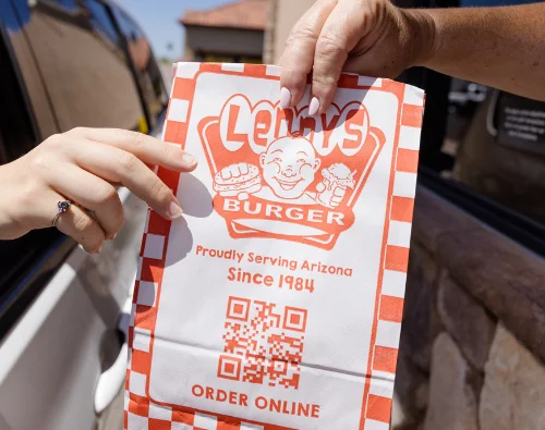 Lenny's Burger takeout bag at a drive-thru