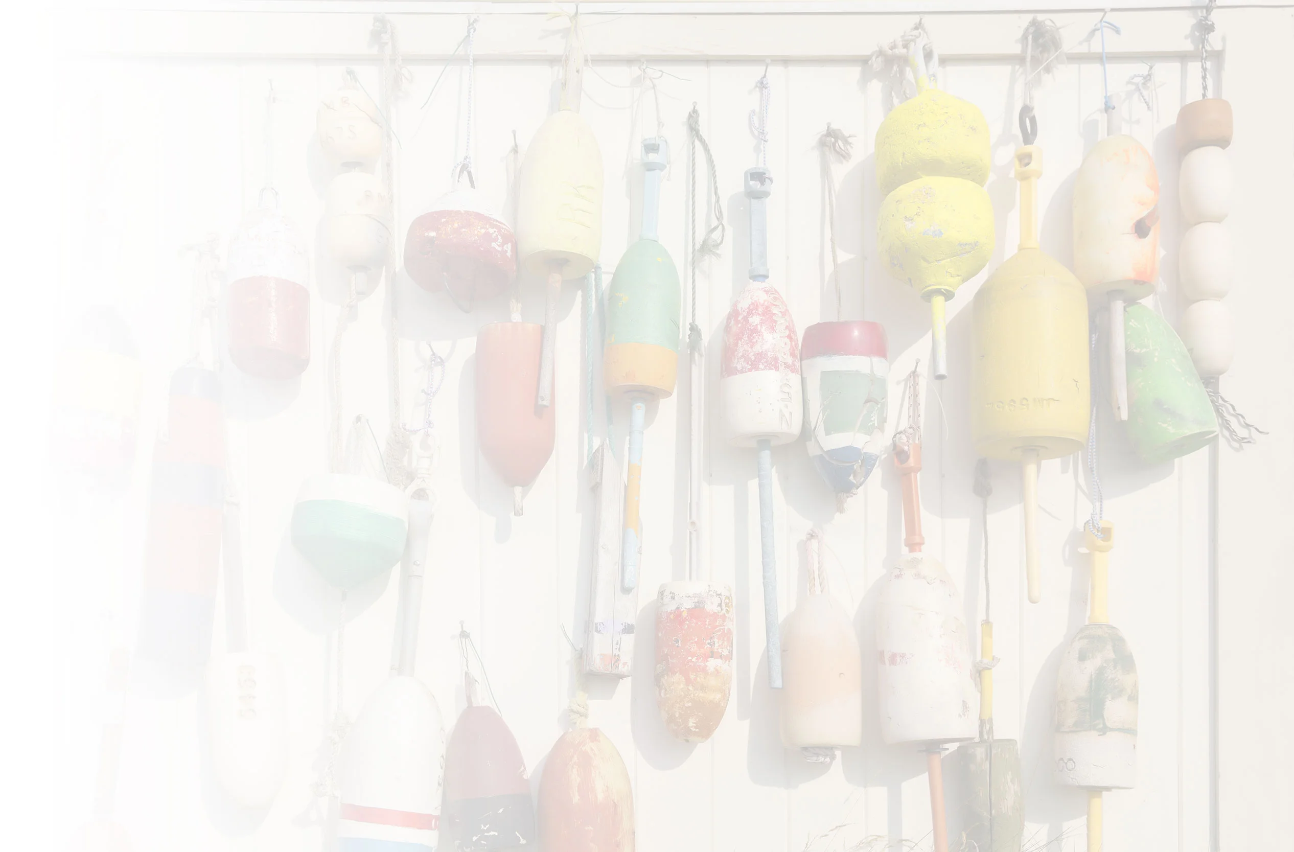 Colorful fishing buoys hanging on a wall
