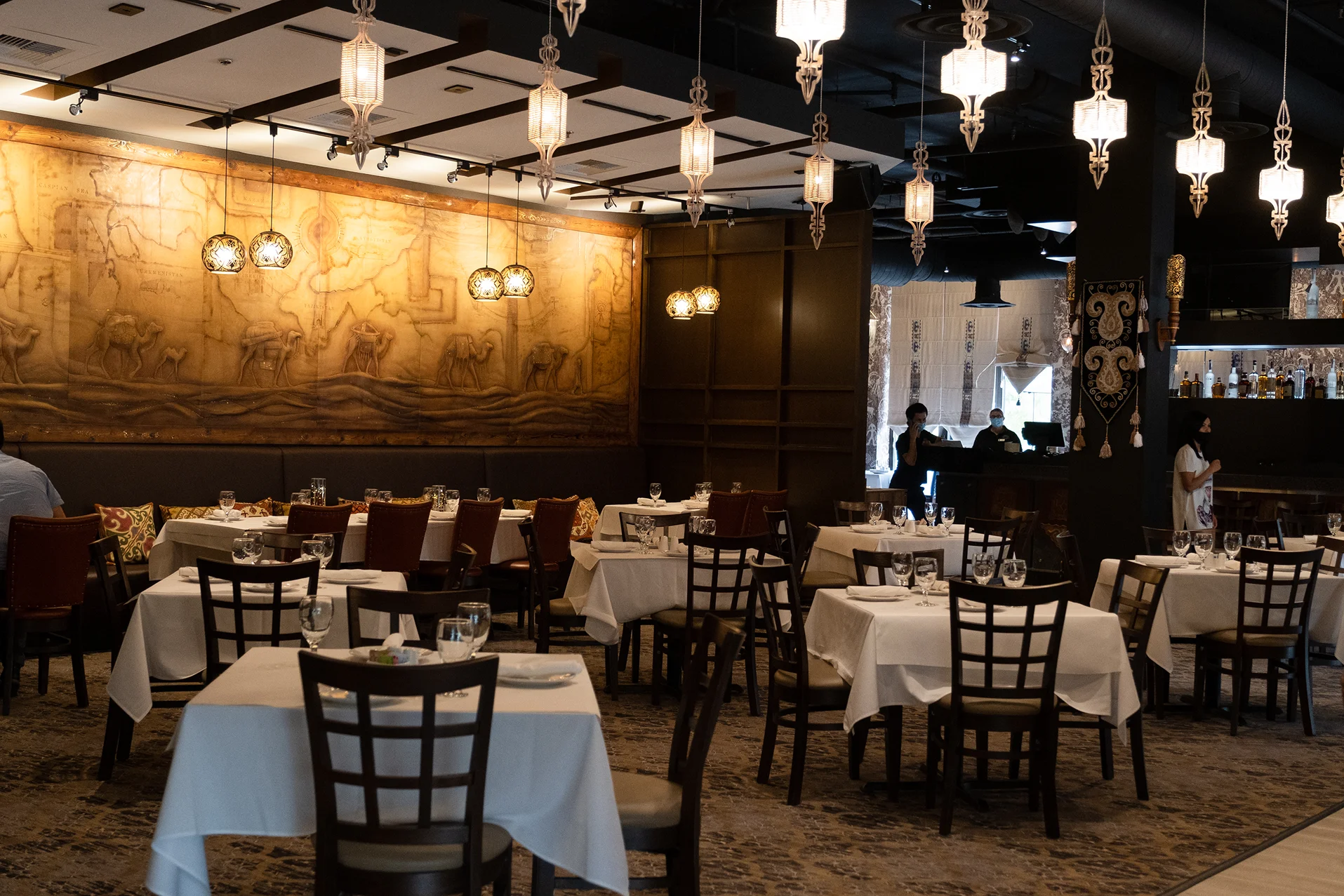 Elegant restaurant interior with artistic wall decor and ambient lighting