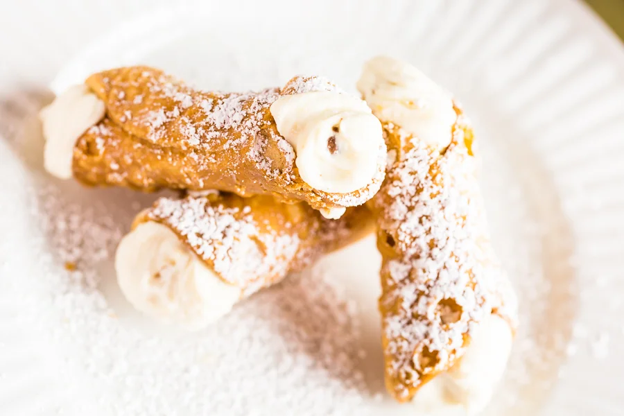 Italian cannoli dusted with powdered sugar