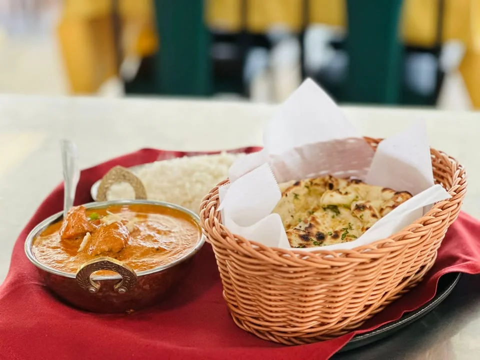Butter chicken with naan and basmati rice
