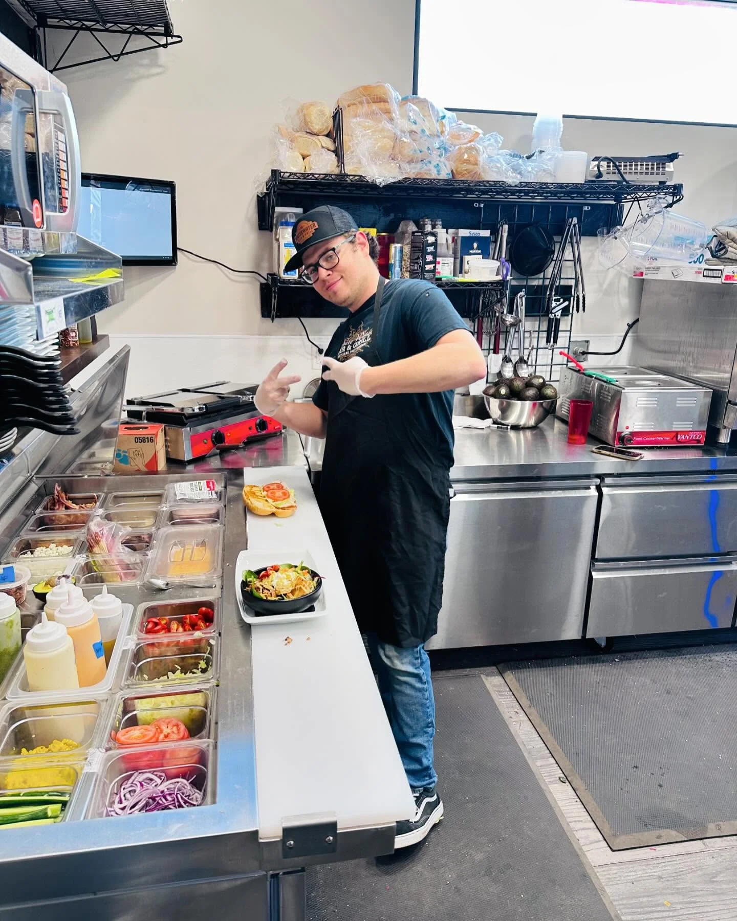 Chef preparing gourmet burgers in a modern kitchen