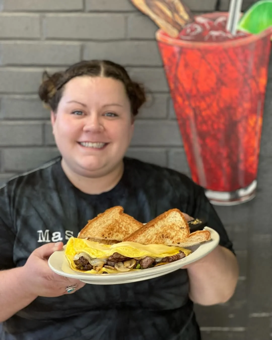 Delicious steak omelette with toast in a cozy diner setting