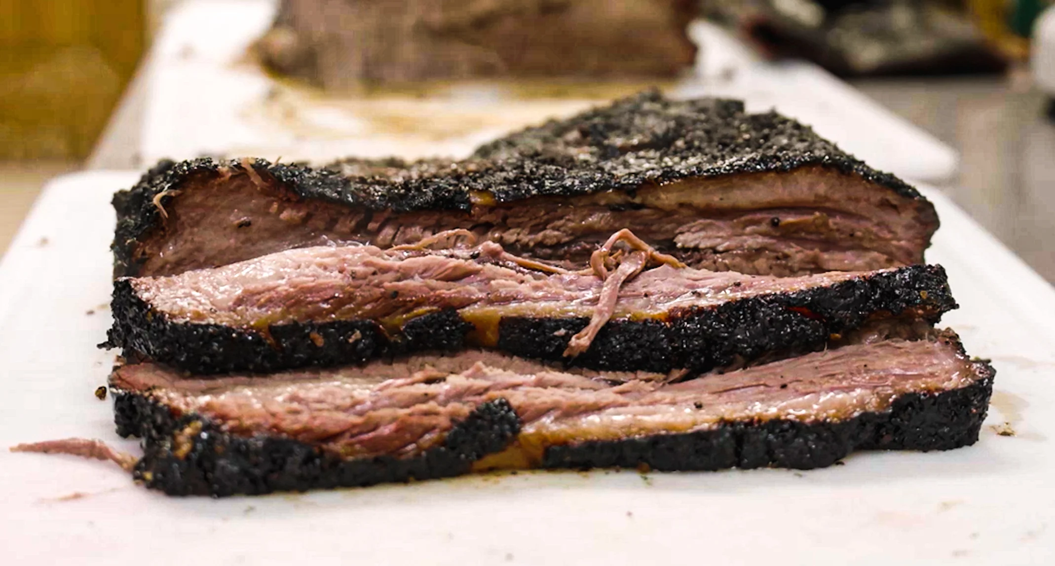 Smoked brisket slices on a cutting board