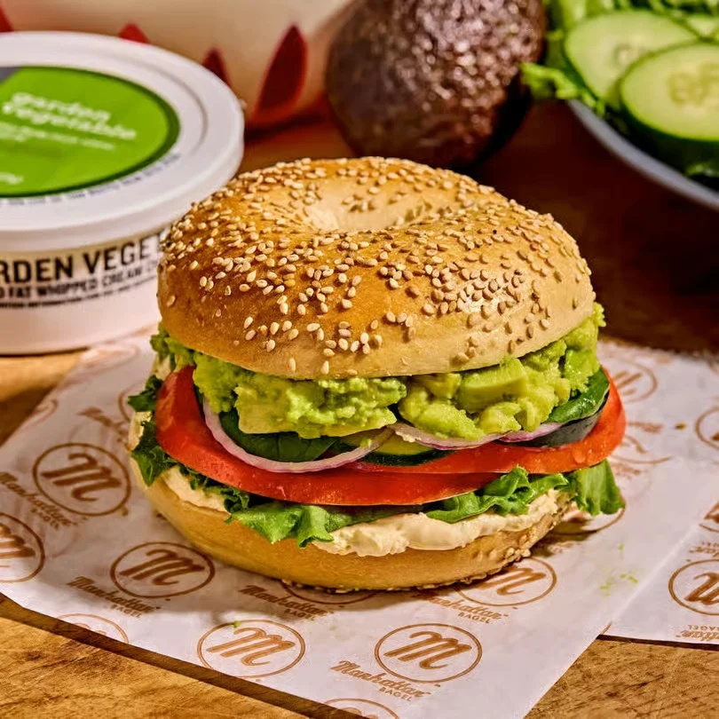 Delicious gourmet burger with fresh toppings on a wooden table
