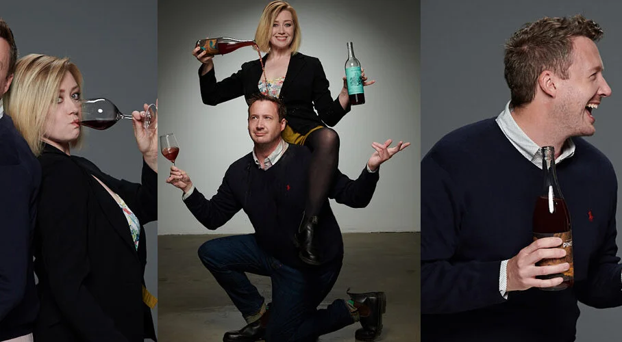 Group of friends enjoying drinks in a playful photo shoot