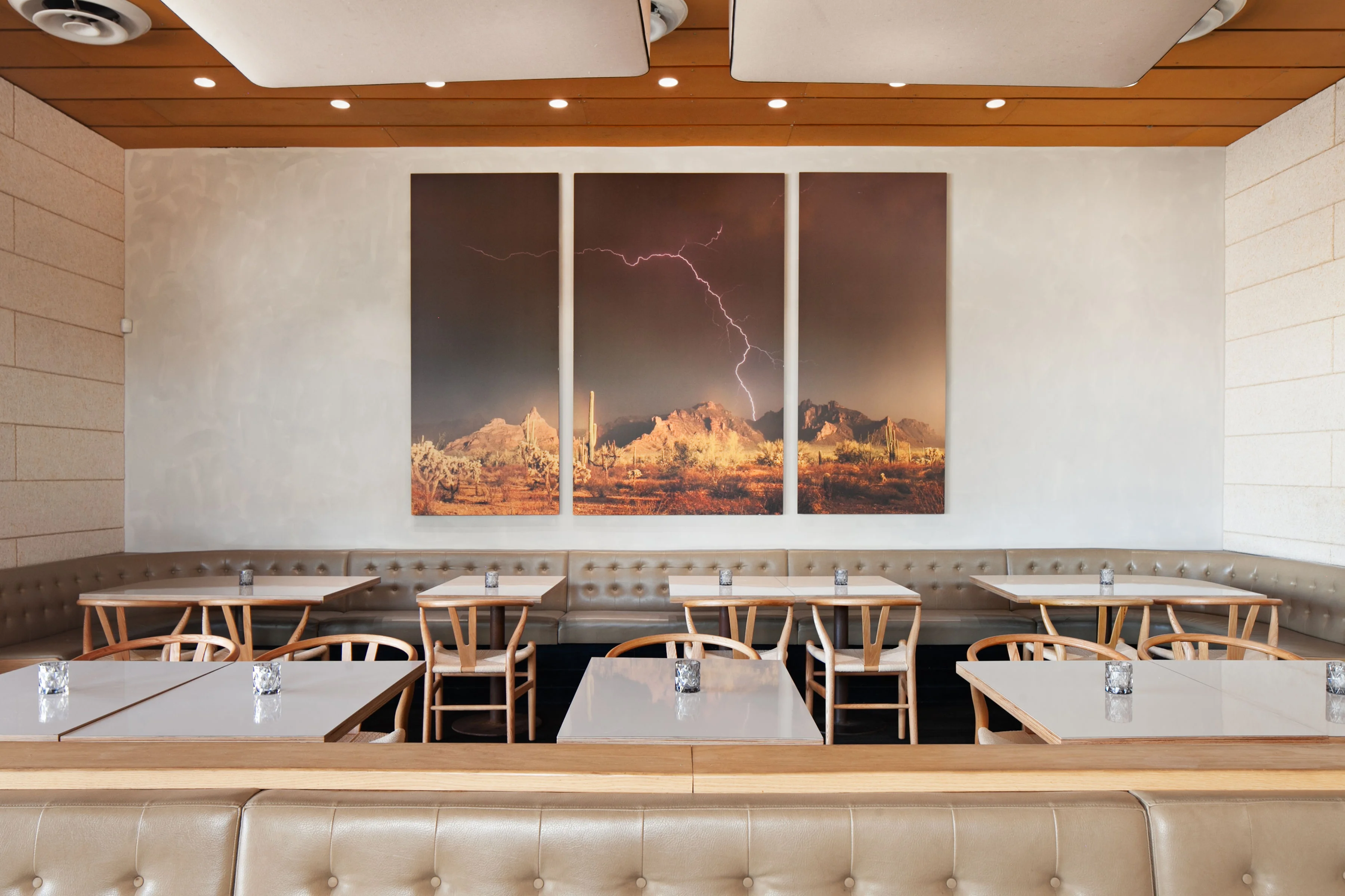 Modern restaurant interior with artistic desert landscape