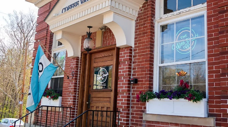 Charming coffee shop exterior with welcoming signage