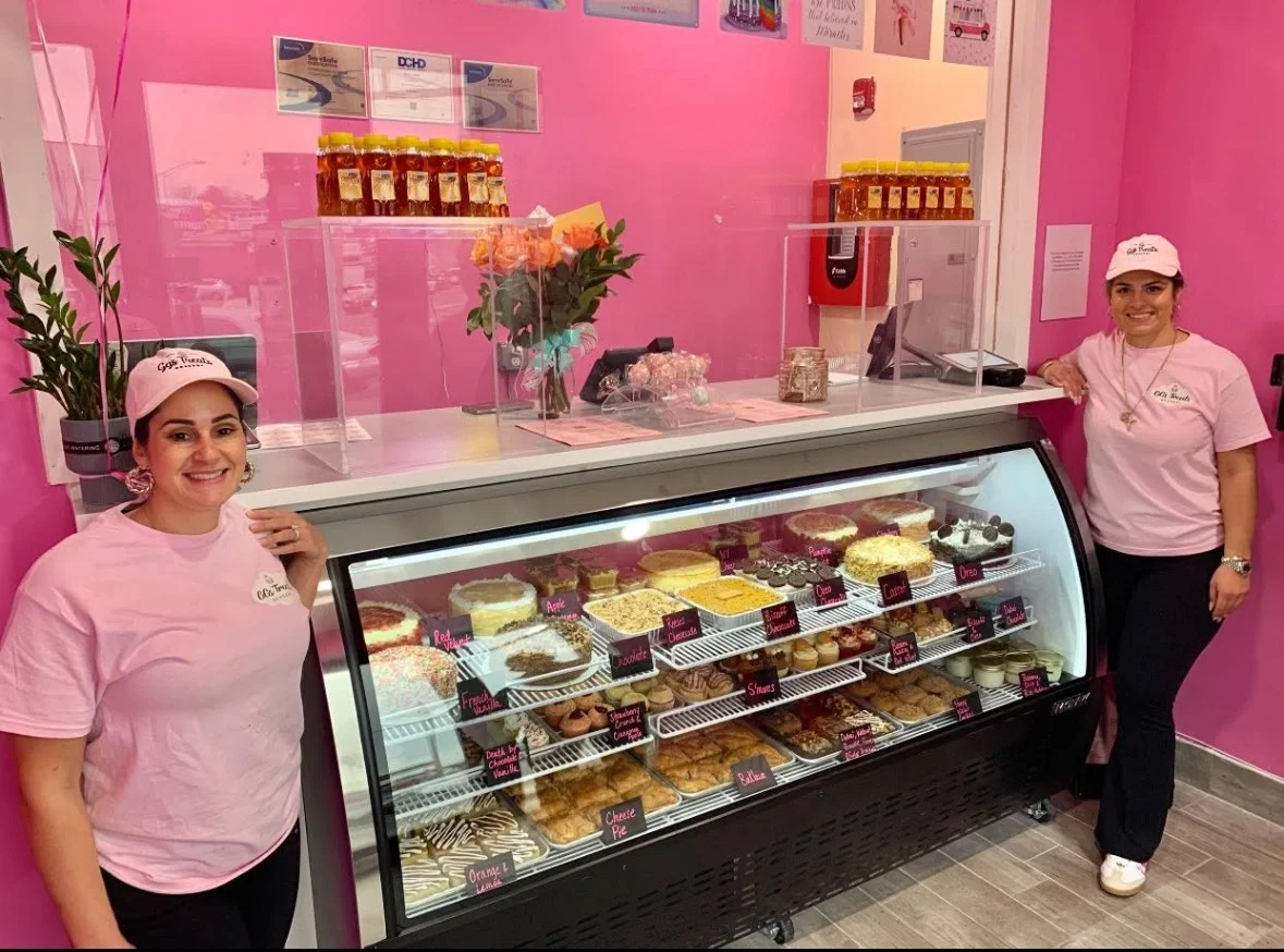 Colorful dessert display in a bakery with various cakes and pastries