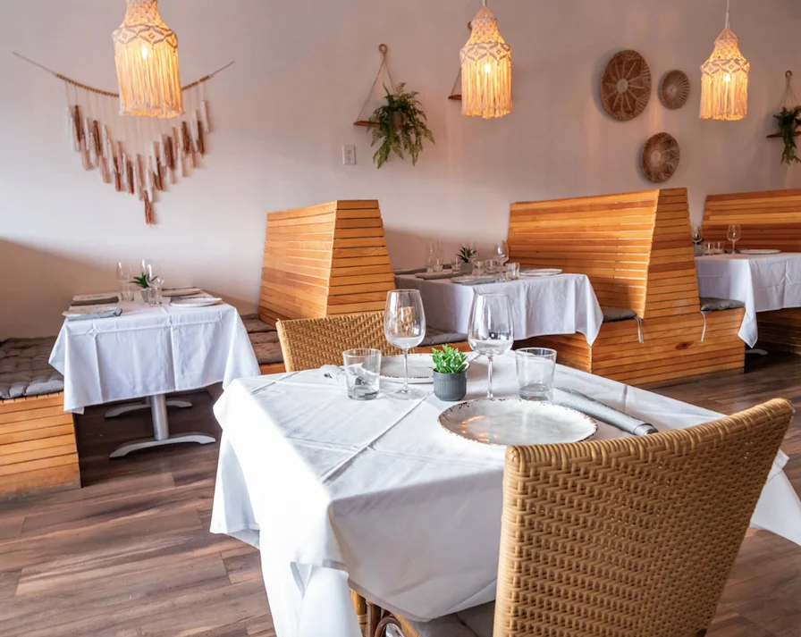 Cozy restaurant interior with wooden booths and warm lighting