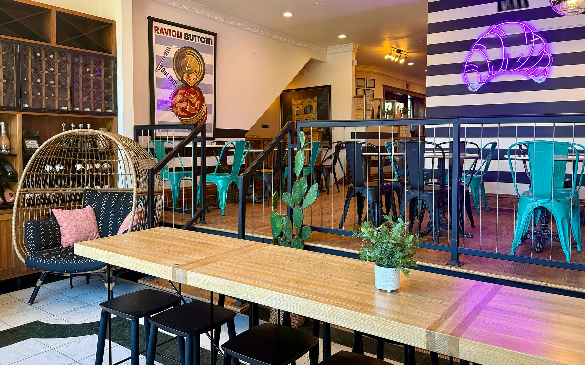 Logan Square café interior with sunlit tables and fresh pastries at La Boulangerie & Co.