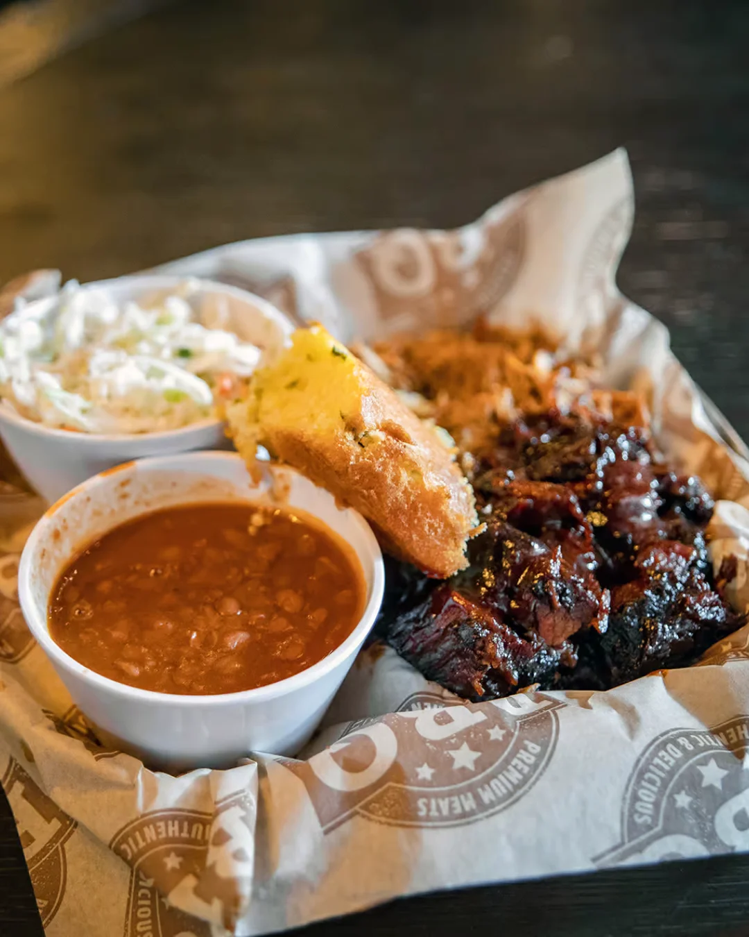 Barbecue platter with pulled pork, cornbread, and baked beans