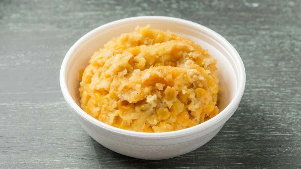 Corn pudding from VooDoo BBQ in Pensacola, a creamy Southern-style side made with sweet corn.