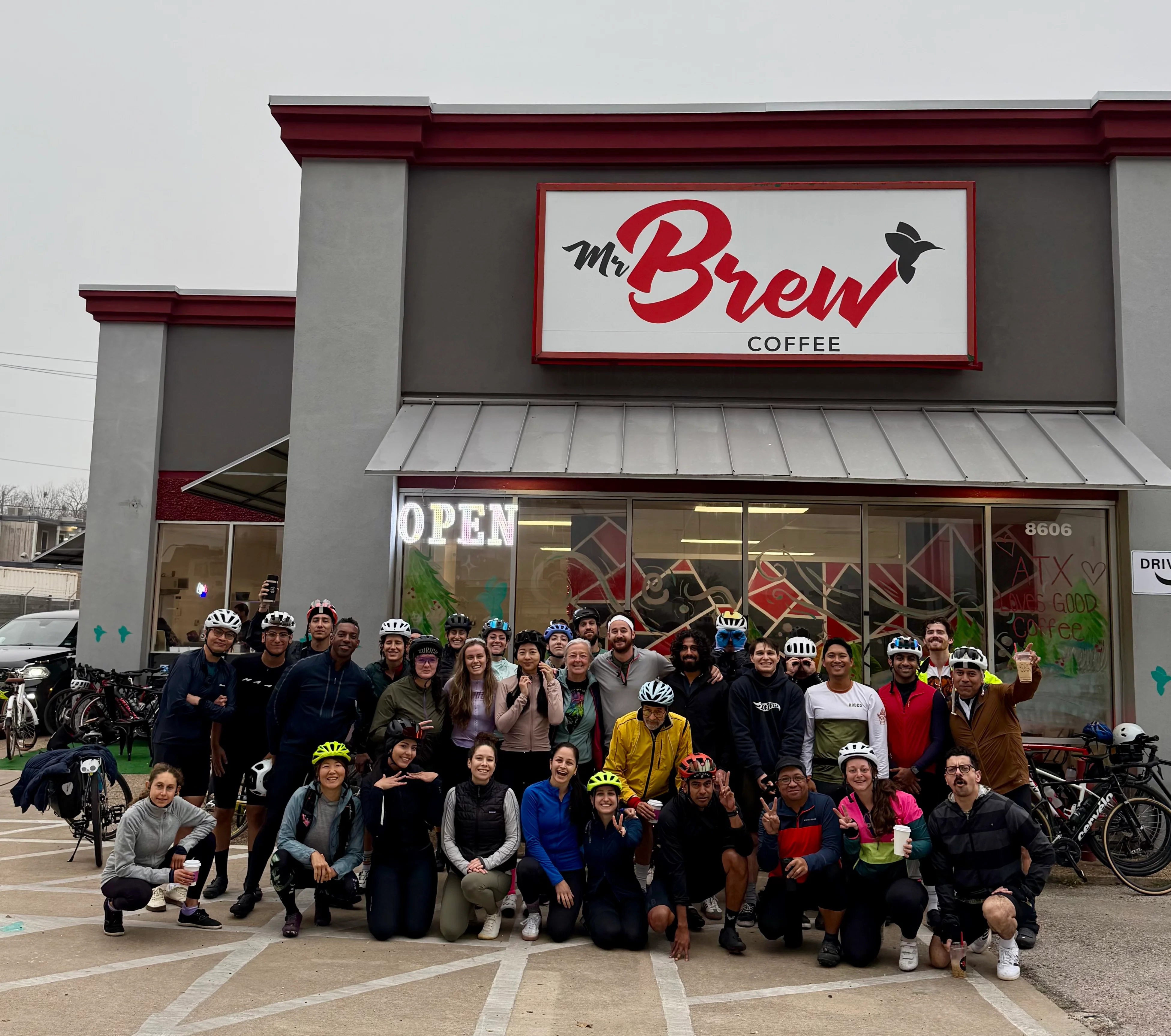 Group of cyclists at Mr Brew Coffee shop