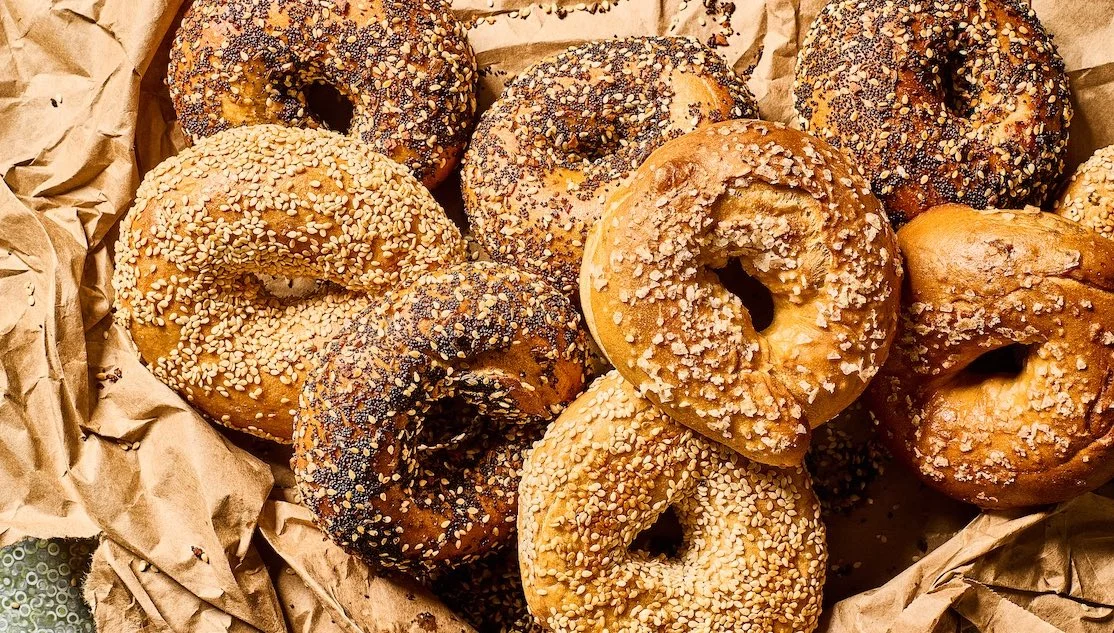 Freshly baked bagels with sesame and poppy seeds