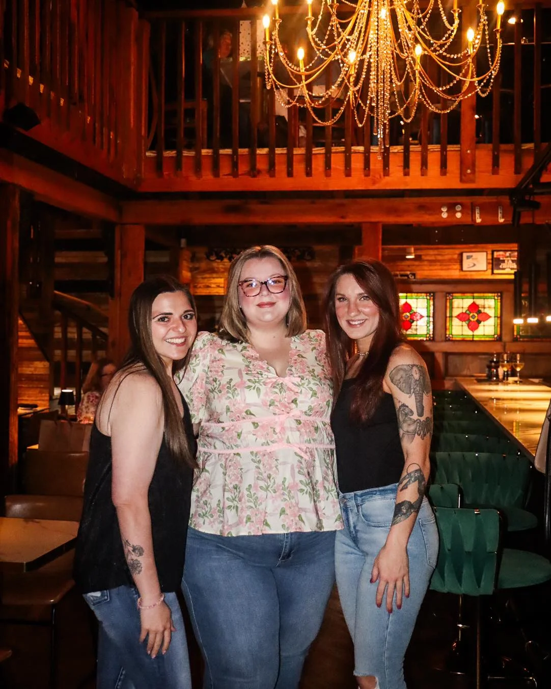 Group of friends posing in a cozy restaurant interior
