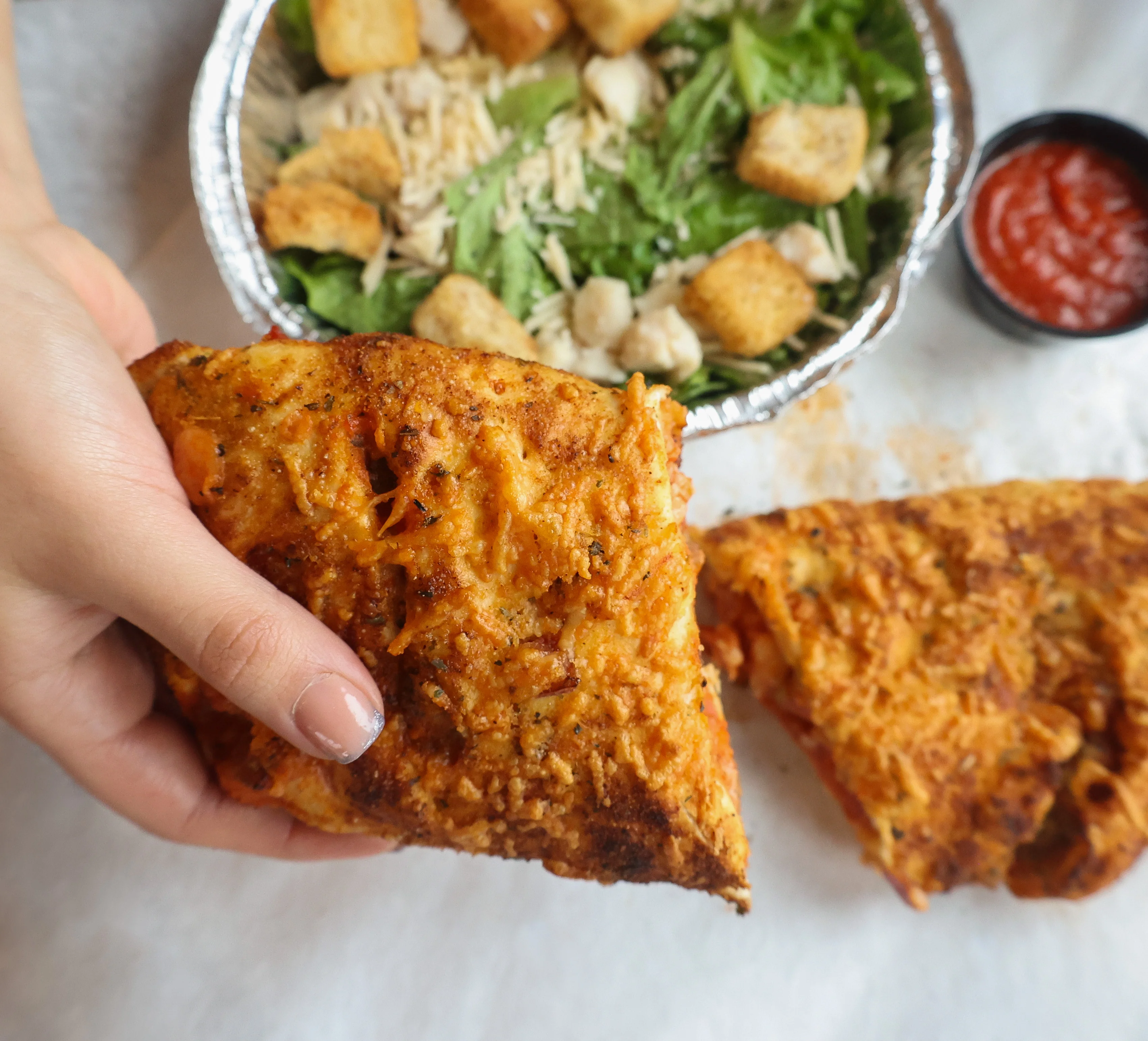 Discover the welcoming charm of a family-owned pizzeria at Village Pizza, where delicious pies and a warm atmosphere create the perfect gathering spot for all ages.