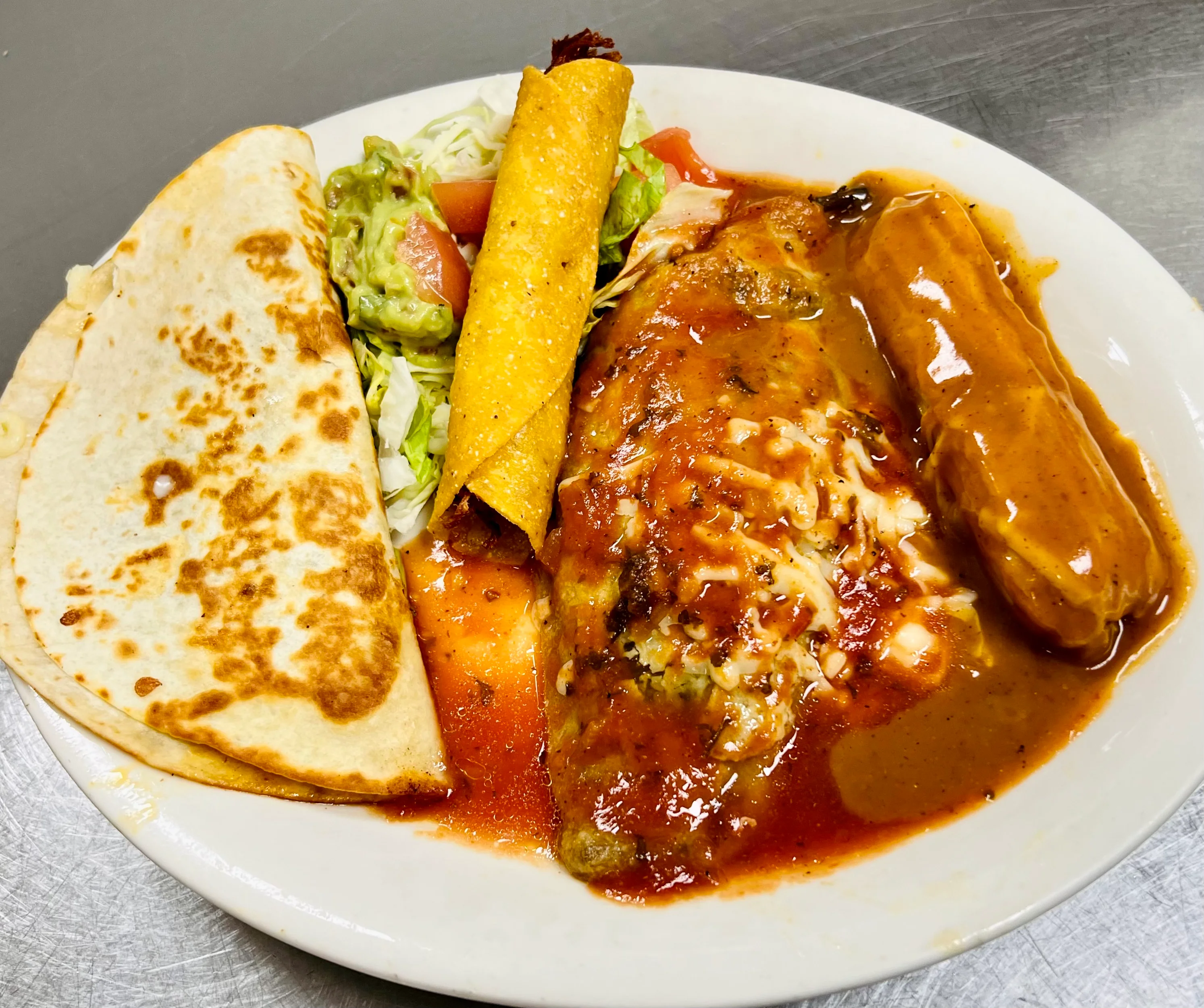 Delicious Mexican plate with enchiladas and tacos