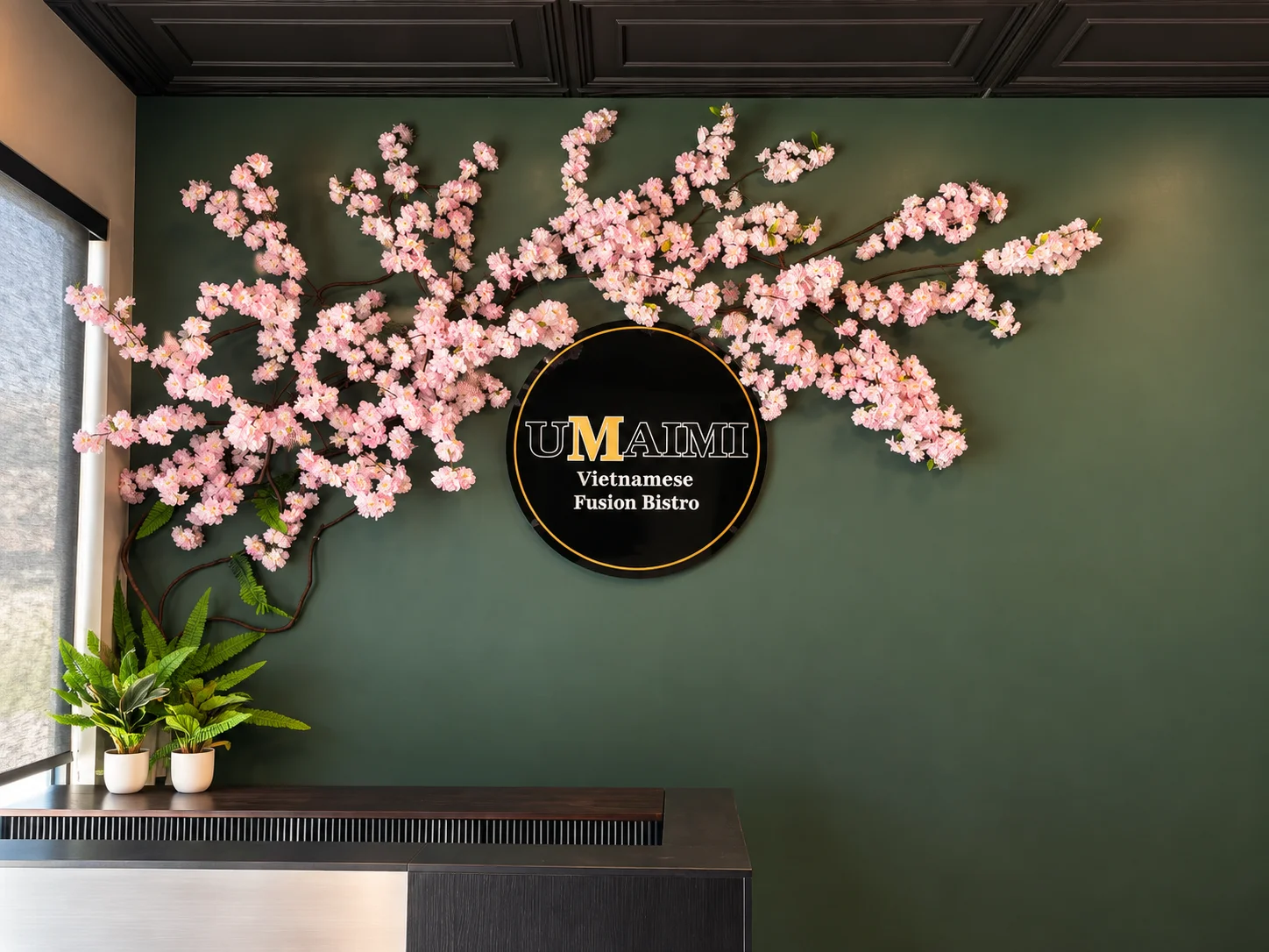 Elegant restaurant interior with cherry blossom decor and modern branding