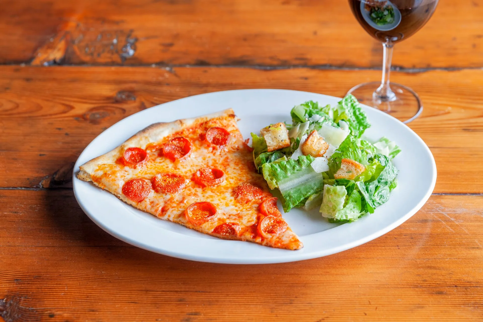 pizza slice and salad