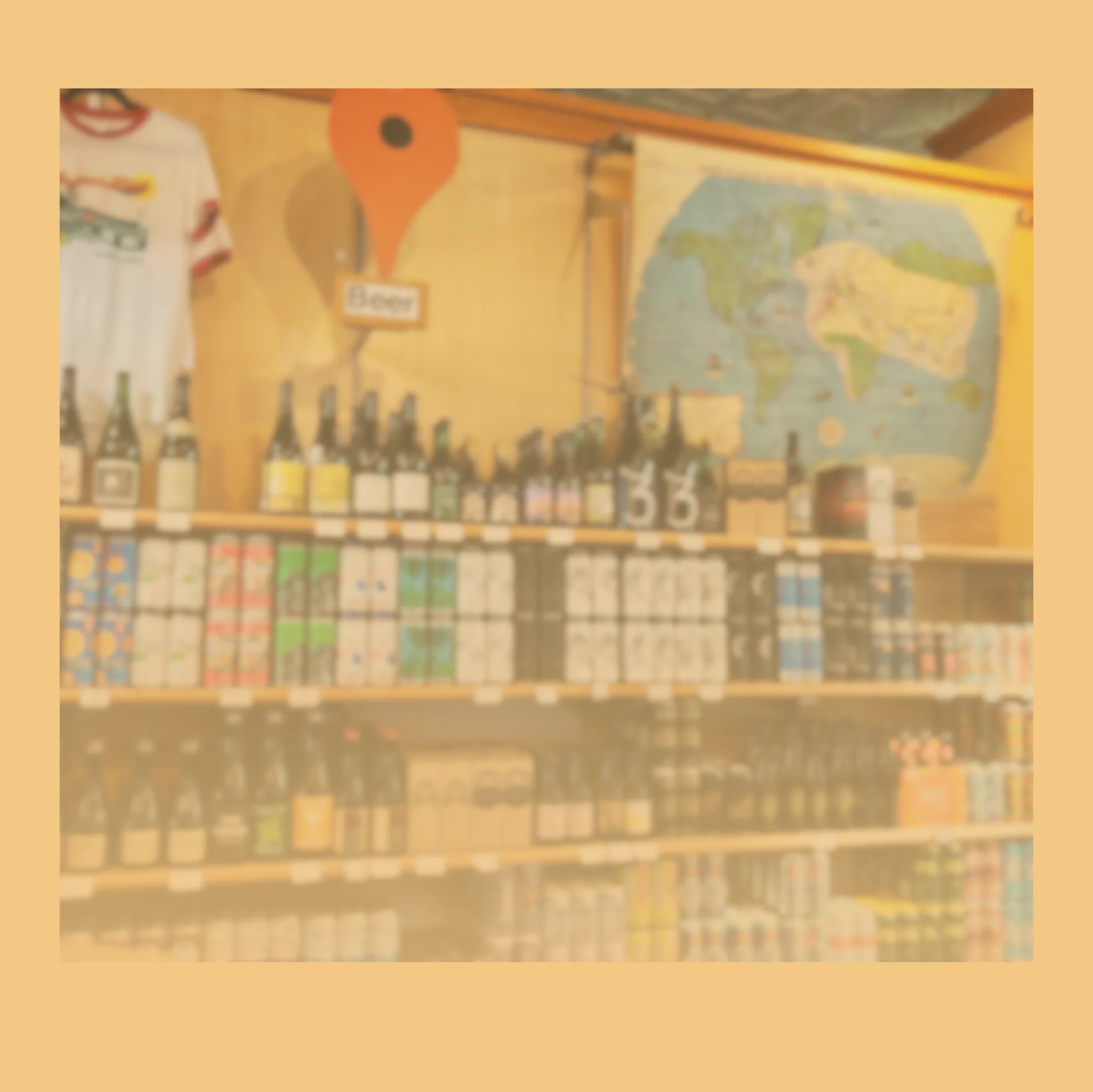Craft beer selection on shelves with a world map backdrop