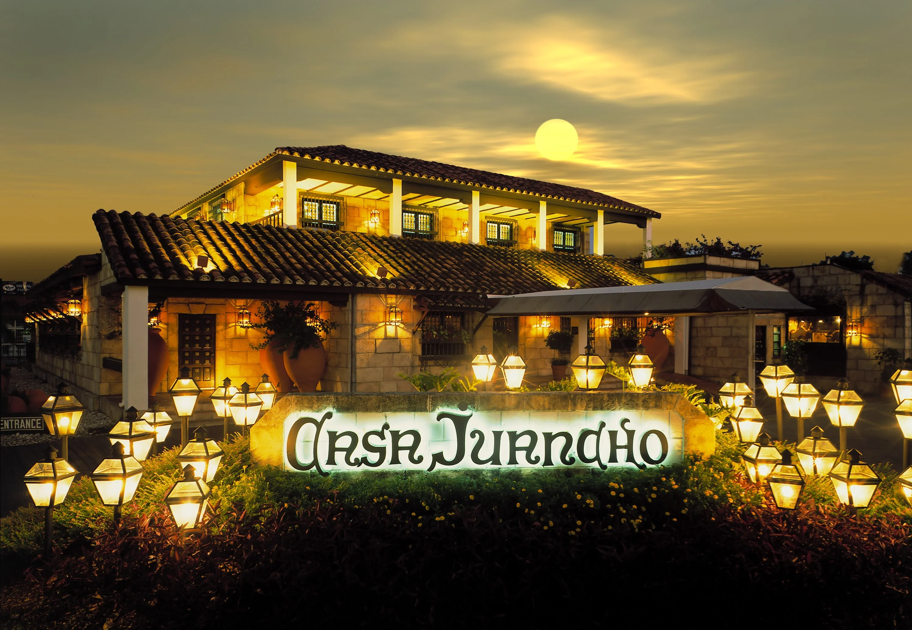 The exterior of Casa Juancho restaurant in Miami, featuring its rustic Spanish-style façade, wooden accents, and welcoming entrance