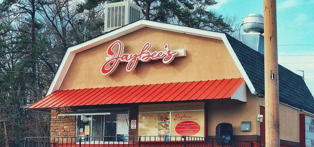 Exterior view of Jaybee's restaurant with a welcoming sign