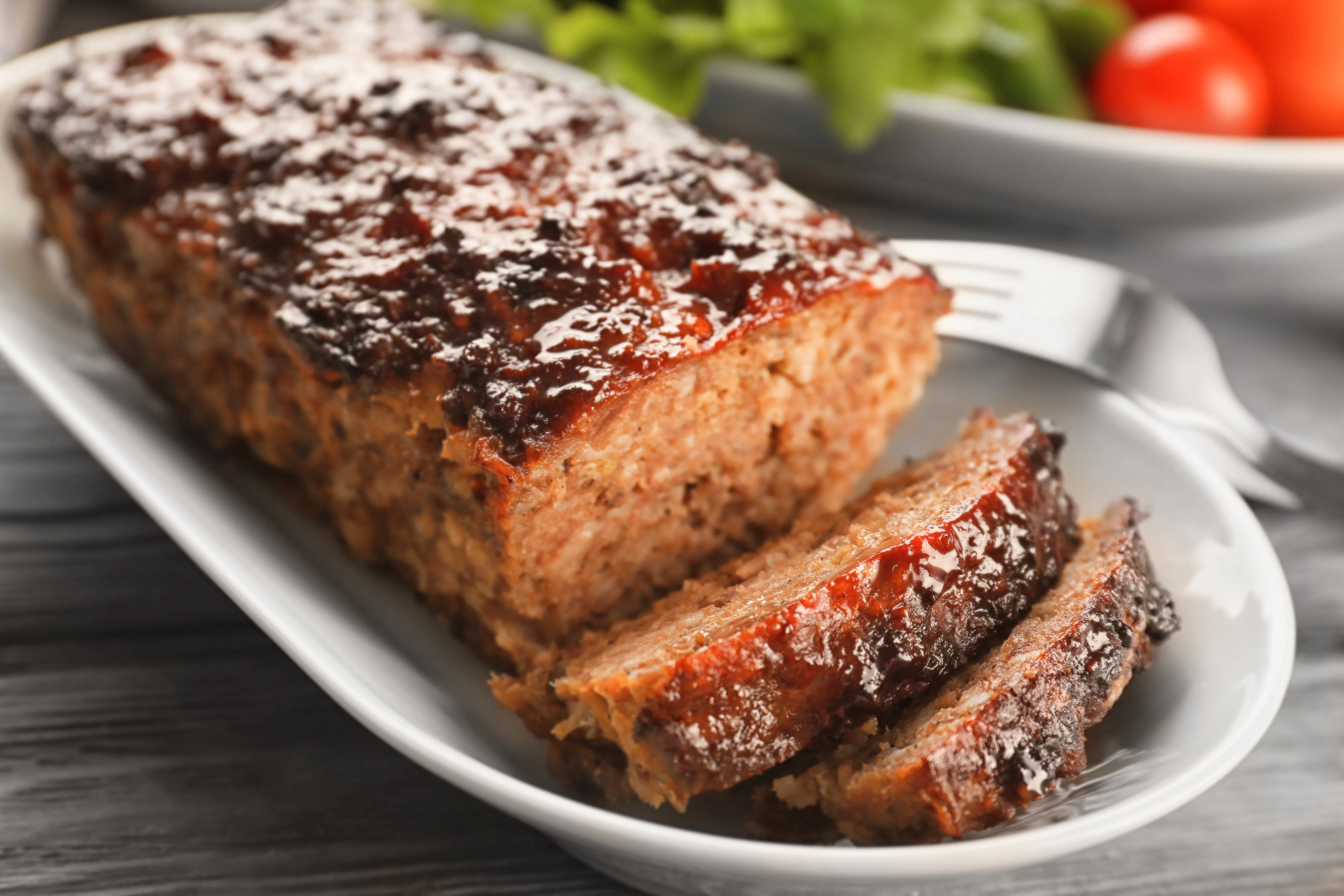 Classic American meatloaf served with a side salad