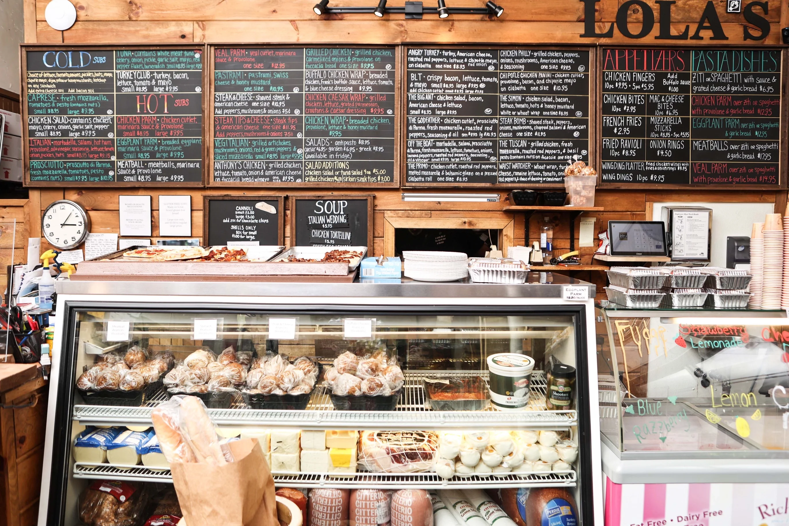 Cozy restaurant counter with a variety of Italian subs and appetizers