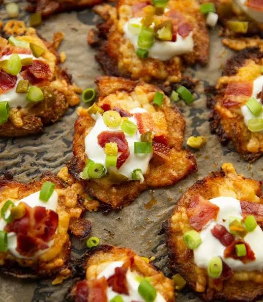 Crispy loaded potato skins topped with bacon and sour cream