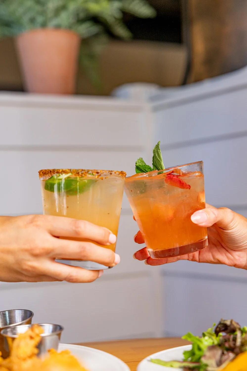 Happy hour drinks and appetizers at Salt Bird restaurant.