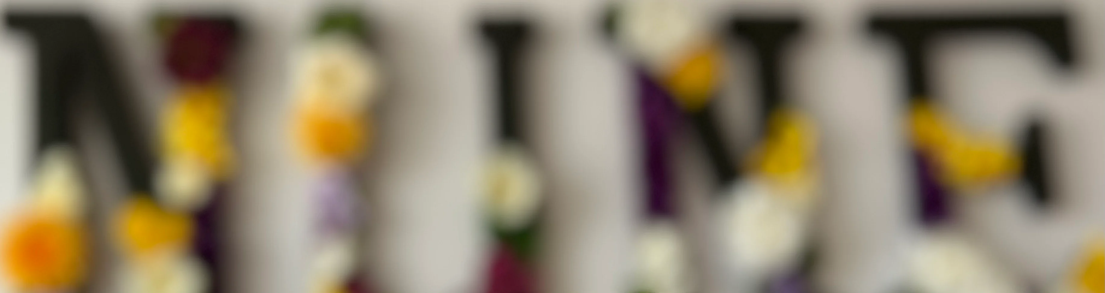 Decorative floral letters spelling 'NINE' in a cozy restaurant setting