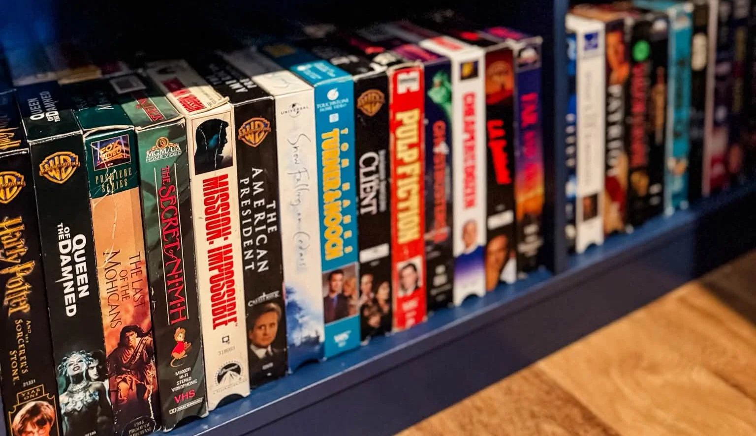 Collection of classic VHS movie tapes on a shelf